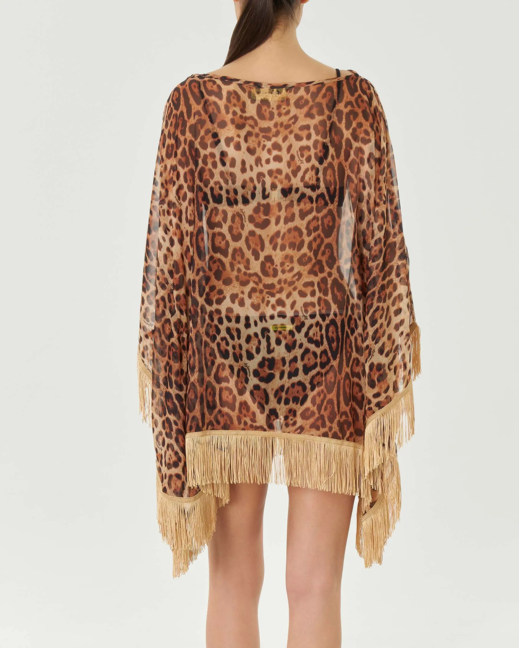Poncho in creponne a fantasia animalier con frange color oro applicate al fondo
